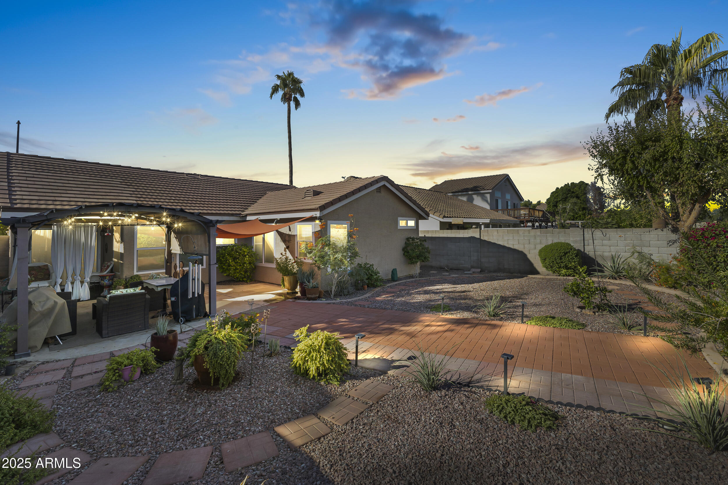 922 West Hudson Way Gilbert, AZ 85233 - Photo 22 of 27 a view of a patio with table and chairs under an umbrella