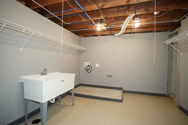 a view of a room with table & chairs