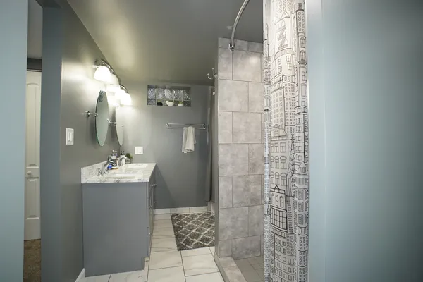 a bathroom with a toilet and a shower