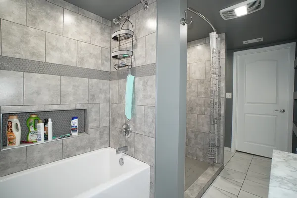 a bedroom with a bed and wall painting