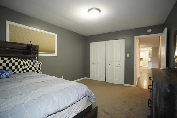 a room with a bed and furniture