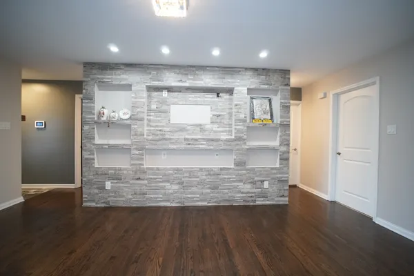 a view of kitchen cabinets and wooden floor