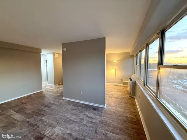 a view of gallery with wooden floor