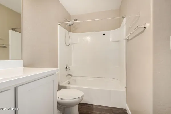 a bathroom with a sink a toilet and a bathtub