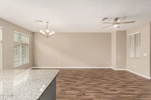 a view of a livingroom with a chandelier fan