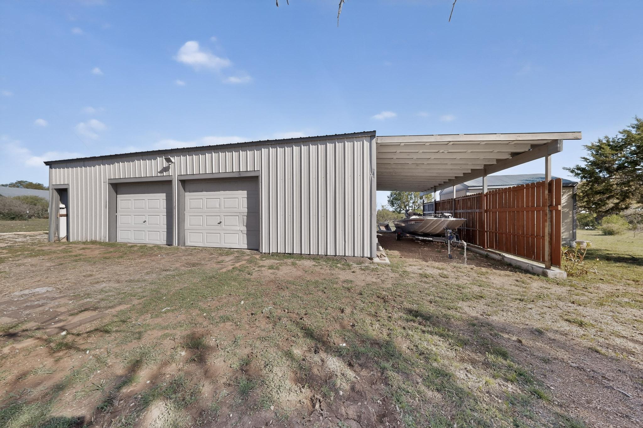 1619 Althaus Ranch Road Johnson City, TX 78636 - Photo 32 of 40 Garage, Workshop, Covered RV or boat parking, Office, Other Storage, Dog Run