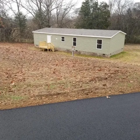 a house with trees in the background