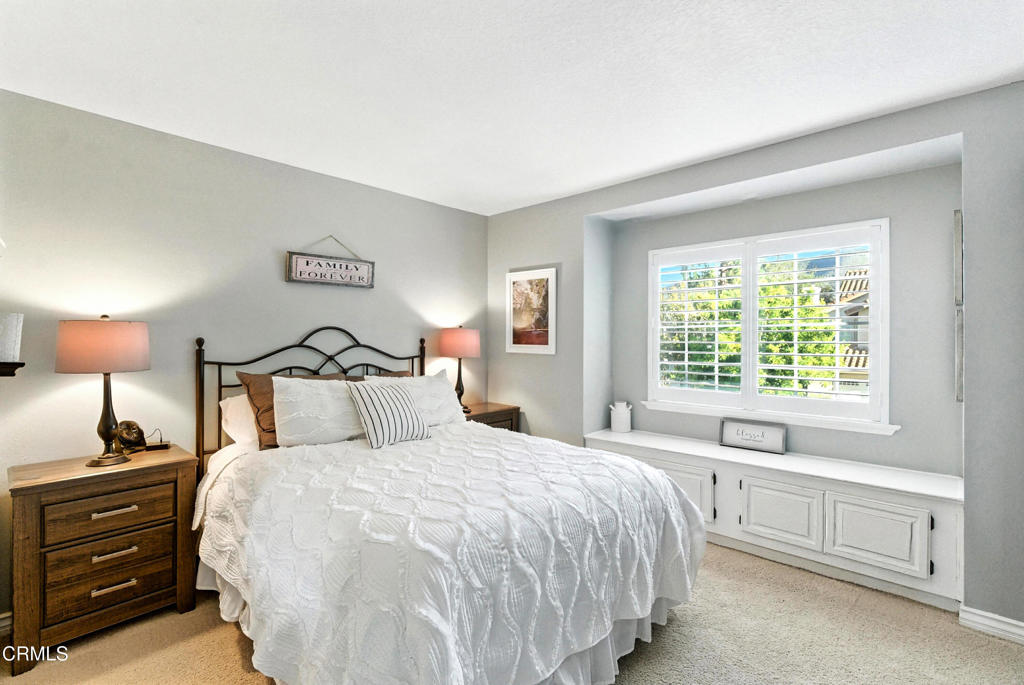 1095 Amberton Lane Thousand Oaks, CA 91320 - Photo 12 of 20 a bedroom with a bed and a window