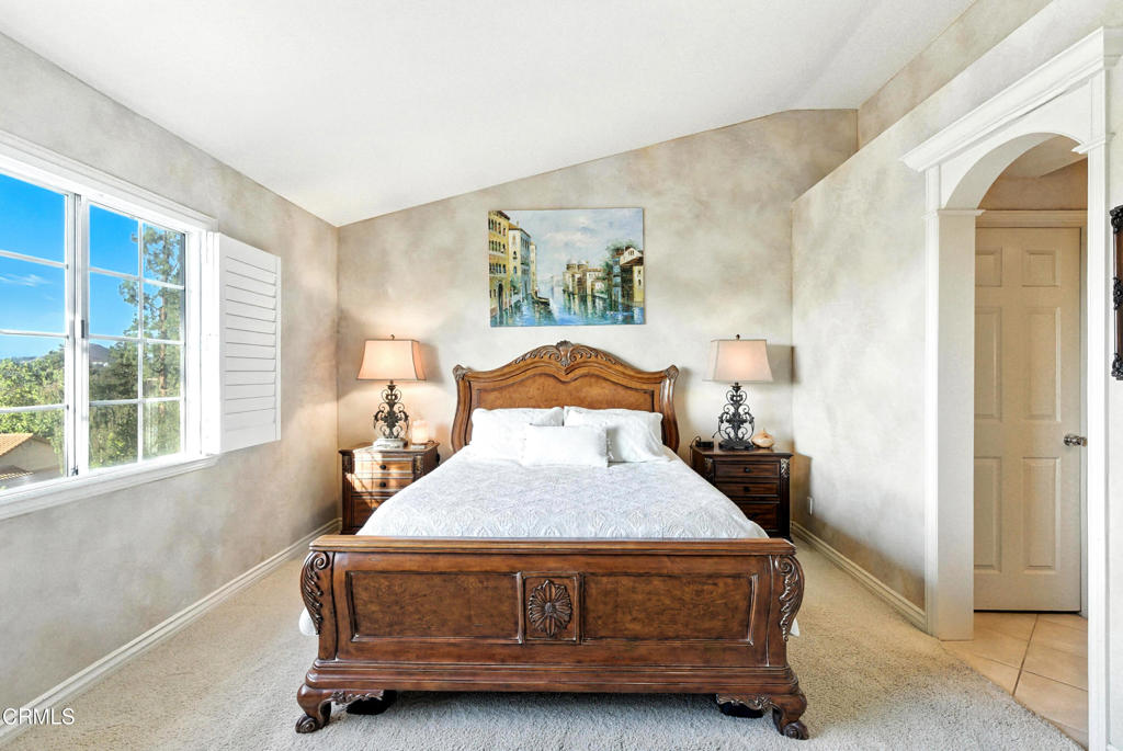 1095 Amberton Lane Thousand Oaks, CA 91320 - Photo 16 of 20 a bedroom with a bed and large windows