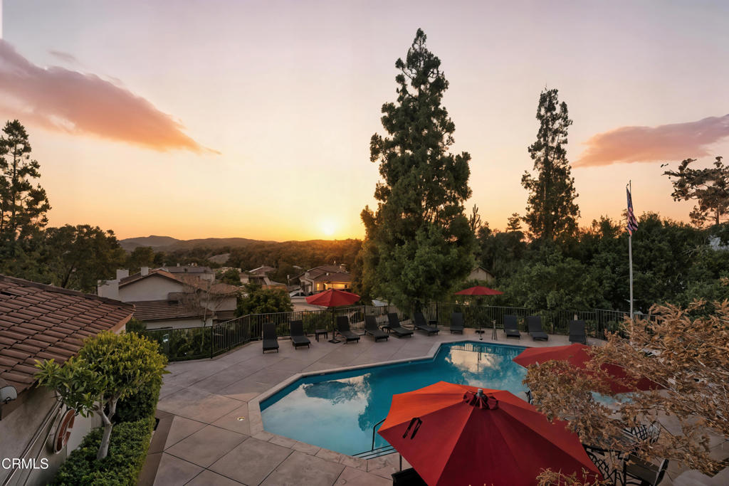 1095 Amberton Lane Thousand Oaks, CA 91320 - Photo 19 of 20 a view of a swimming pool with a yard and mountain view
