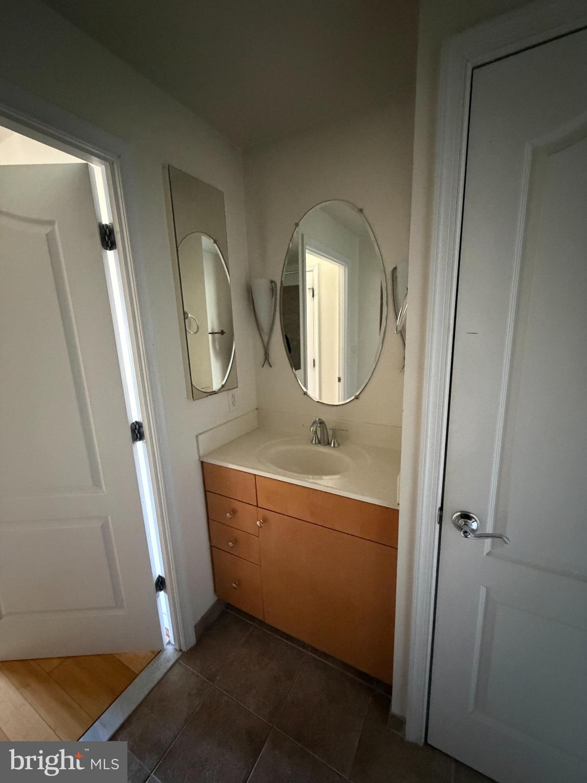 1111 11th Street Northwest, Unit 608 Washington, DC 20001 - Photo 19 of 29 a bathroom with a sink and a mirror
