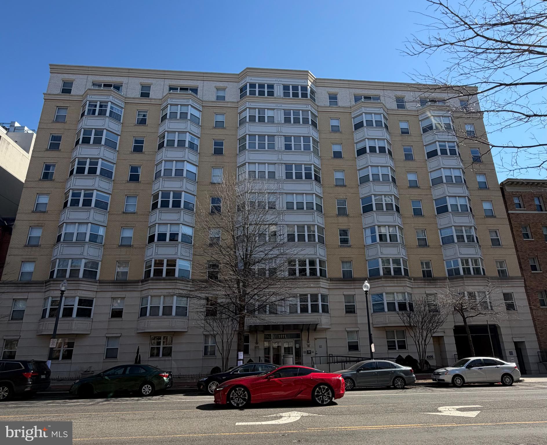 1111 11th Street Northwest, Unit 608 Washington, DC 20001 - Photo 2 of 29 a view of a building and car parked