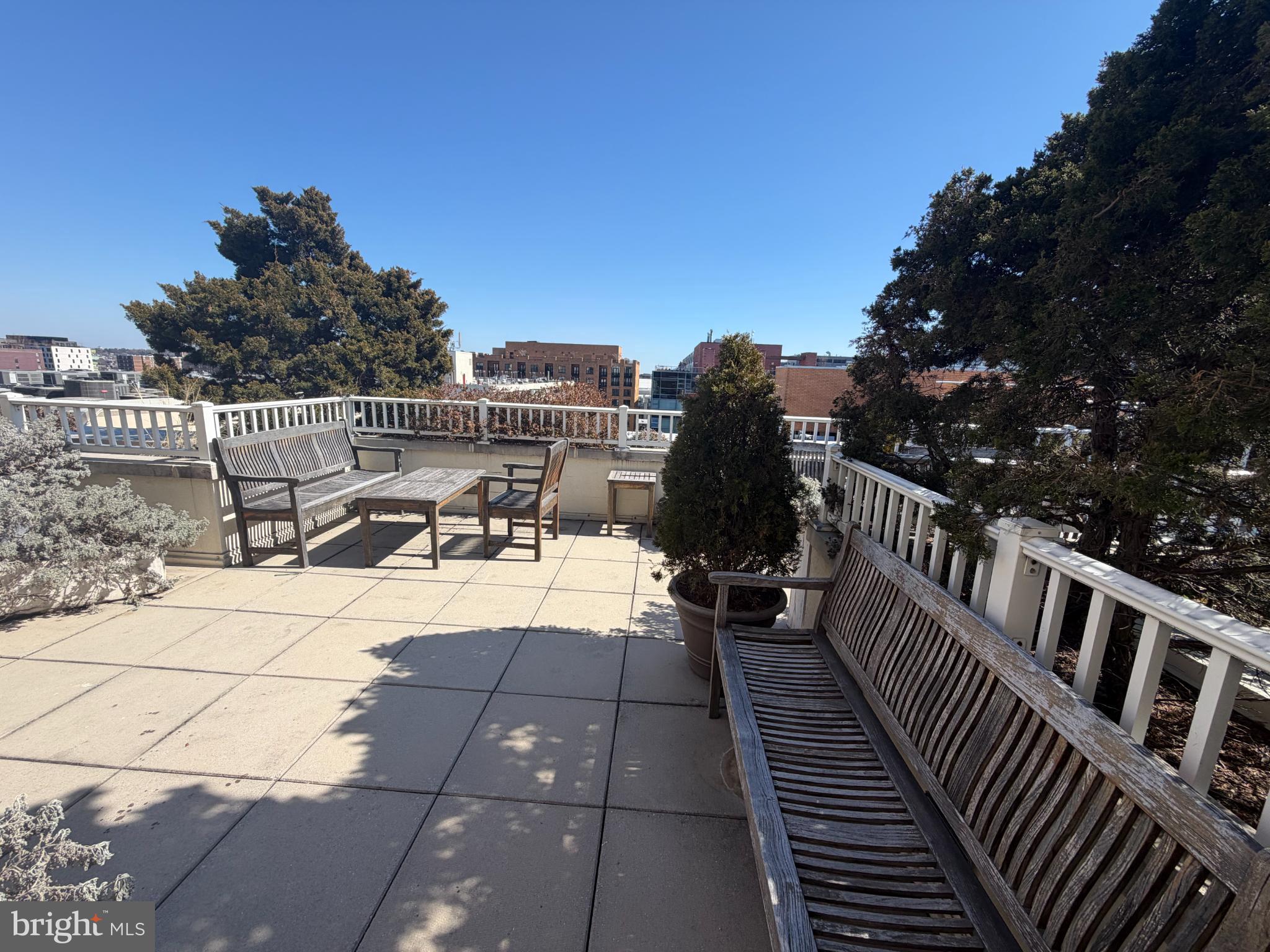 1111 11th Street Northwest, Unit 608 Washington, DC 20001 - Photo 27 of 29 a view of a roof deck with wooden floor and fence