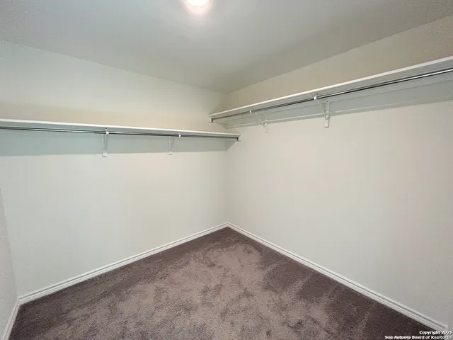 a view of an empty walk in closet