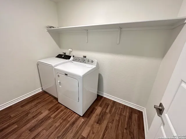 a utility room with washer and dryer
