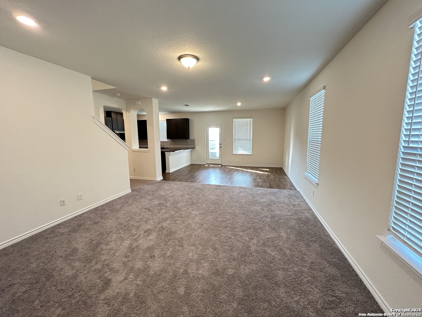 6608 Runaway Row Converse, TX 78109 - Photo 2 of 17 a view of a big room with windows and fireplace