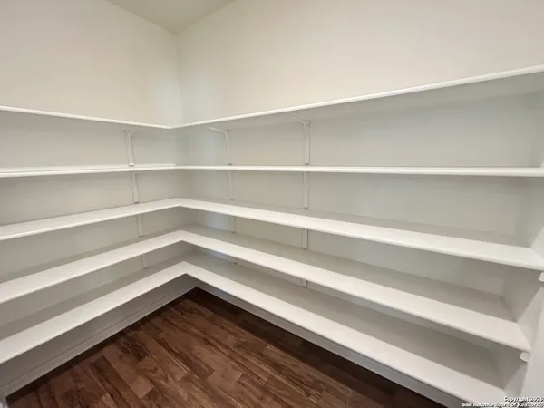 a storage room with wooden floor