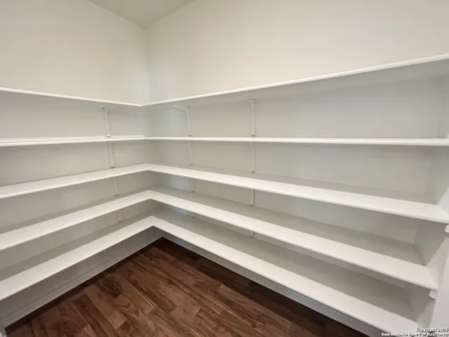 a storage room with wooden floor