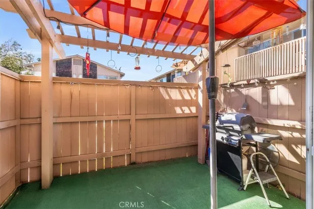 a view of a backyard with a wooden fence
