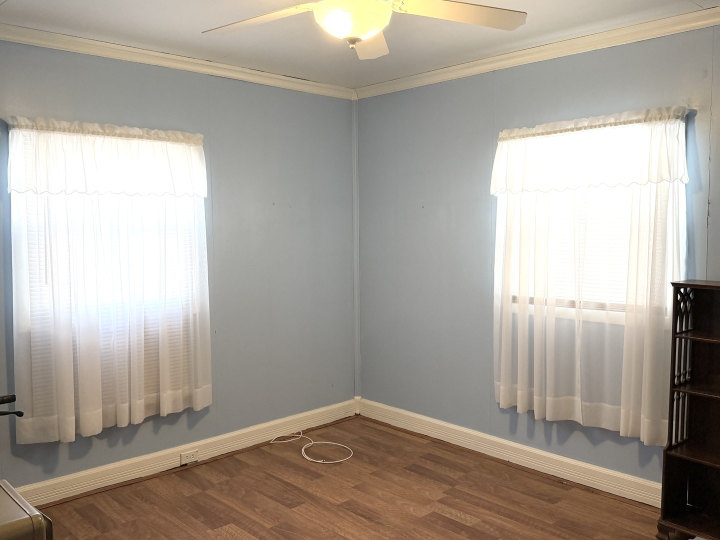 432 Roosevelt Road LaSalle, IL 61301 - Photo 11 of 13 an empty room with wooden floor and a window