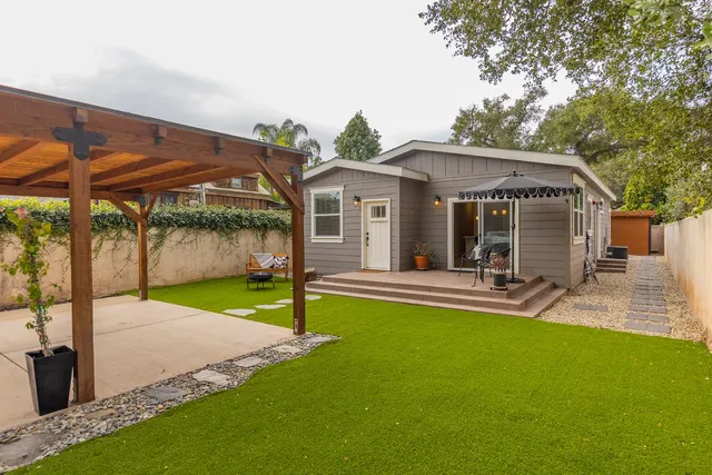 a view of a house with a yard patio and a patio