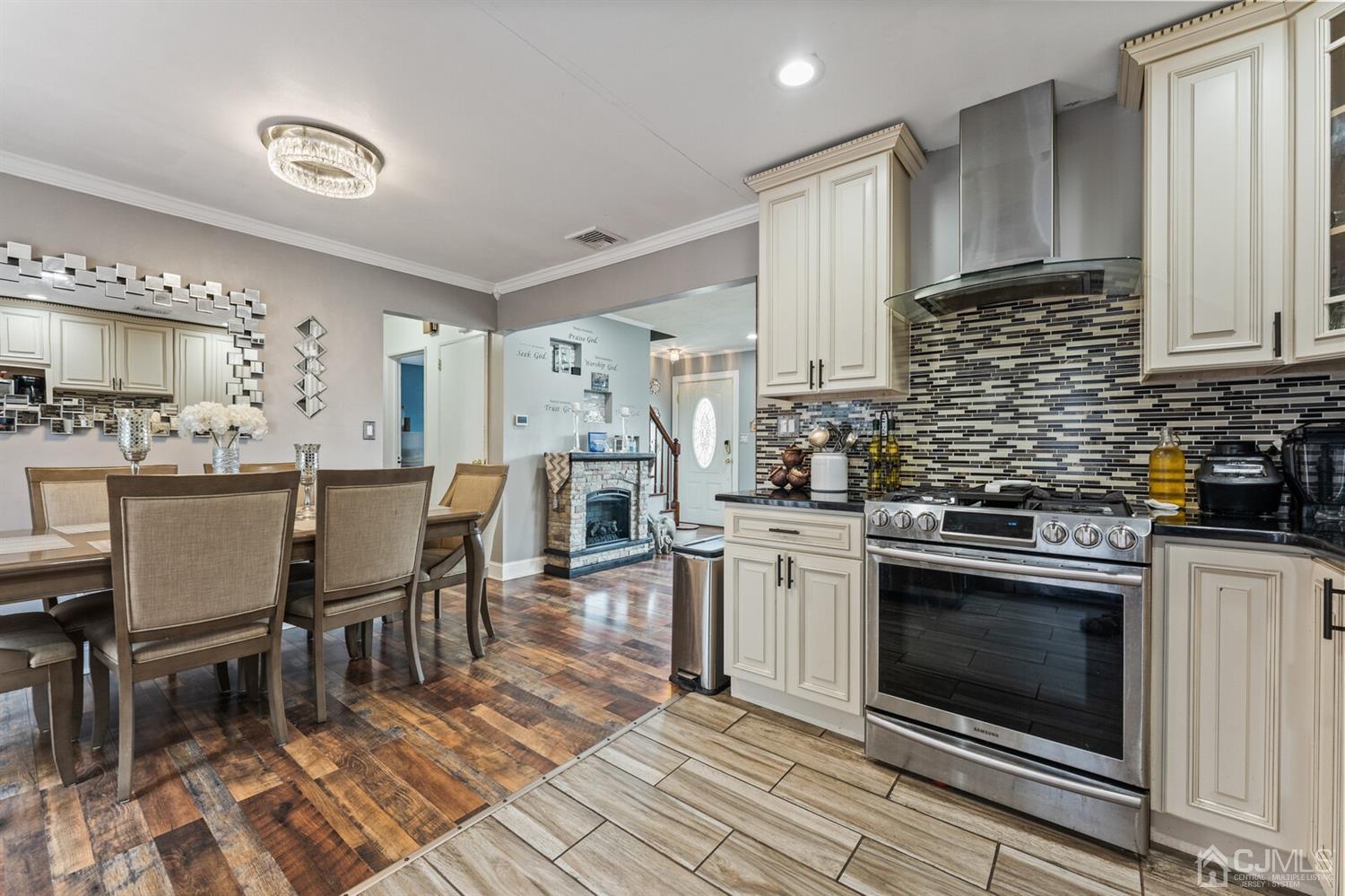 205 Midfield Road Colonia, NJ 07067 - Photo 12 of 26 a kitchen with stainless steel appliances granite countertop a stove top oven a sink dishwasher and a refrigerator