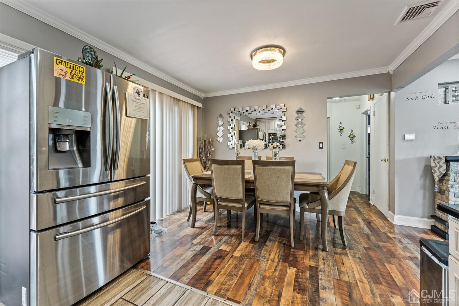 205 Midfield Road Colonia, NJ 07067 - Photo 13 of 26 a view of a dining room with furniture window and wooden floor