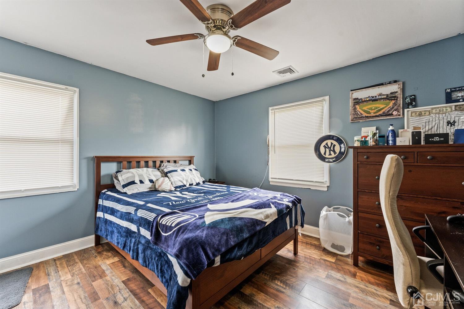205 Midfield Road Colonia, NJ 07067 - Photo 16 of 26 a bedroom with a bed and a chandelier