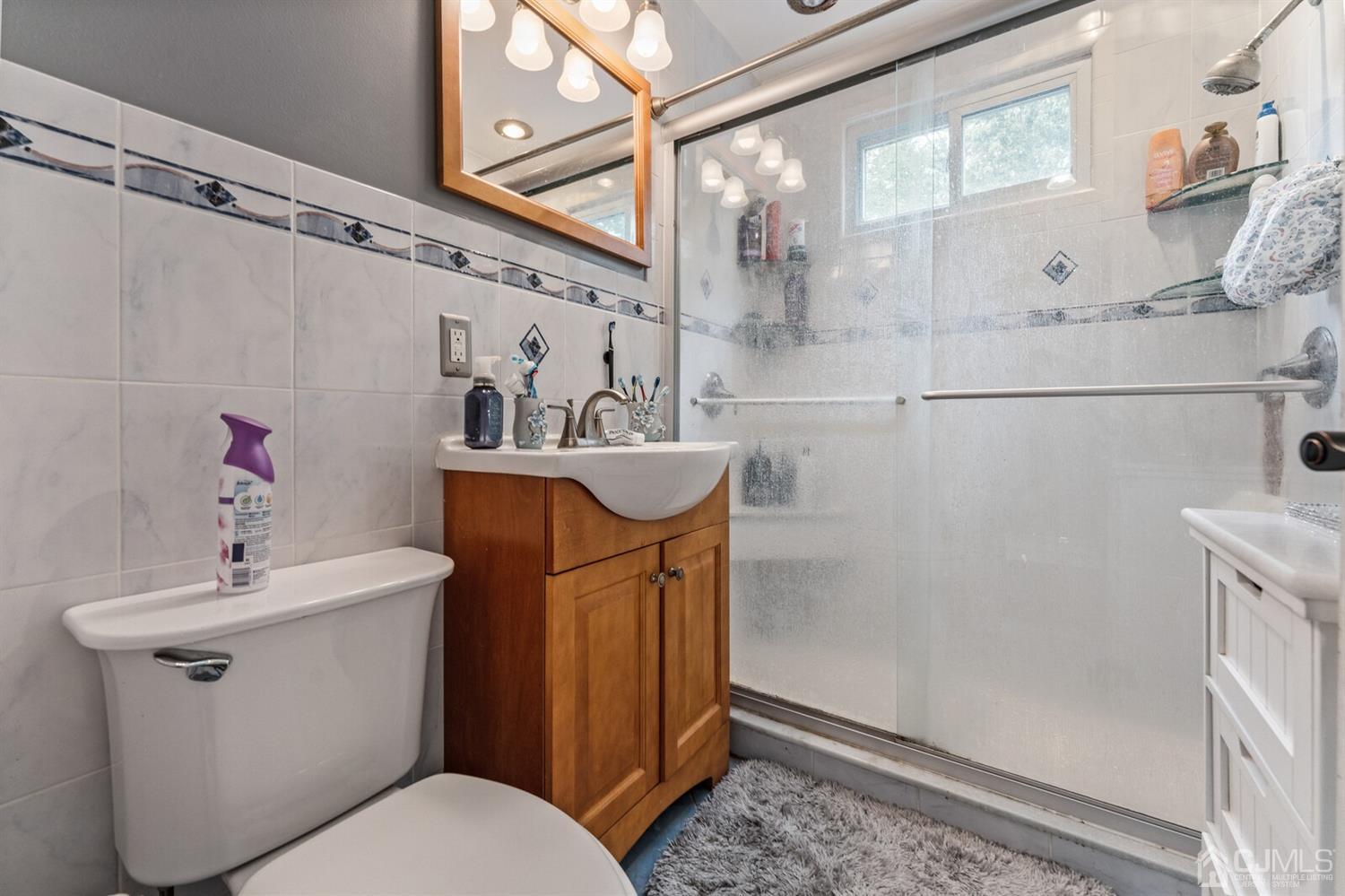 205 Midfield Road Colonia, NJ 07067 - Photo 18 of 26 a bathroom with a sink toilet and shower