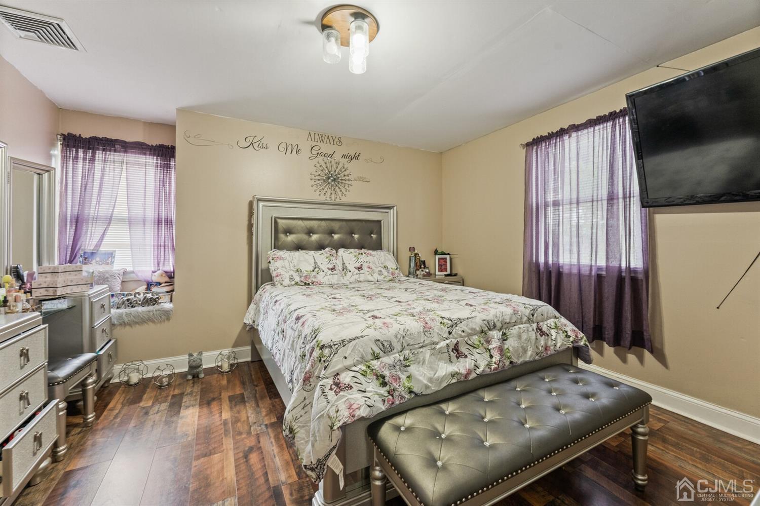 205 Midfield Road Colonia, NJ 07067 - Photo 19 of 26 a bedroom with a bed and flat screen tv