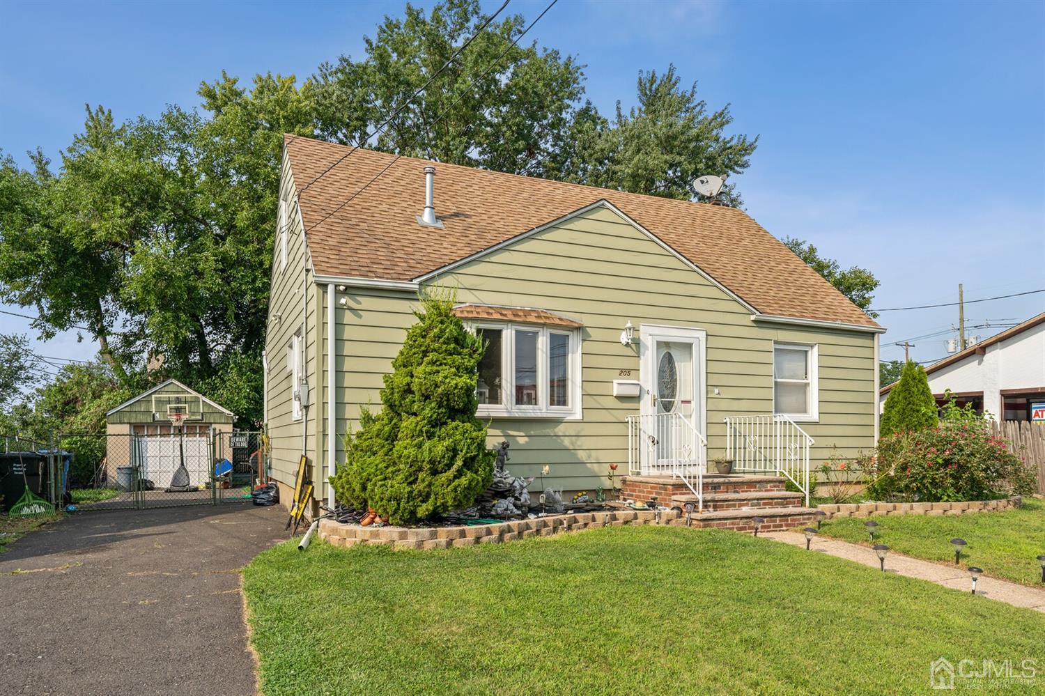 205 Midfield Road Colonia, NJ 07067 - Photo 3 of 26 front view of a house with a yard