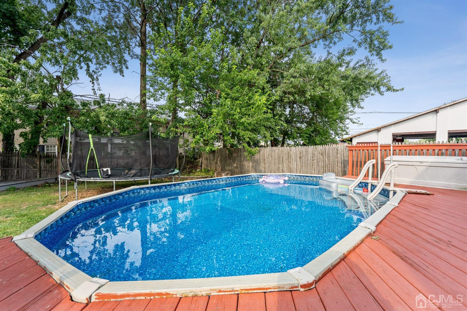 205 Midfield Road Colonia, NJ 07067 - Photo 23 of 26 a view of a swimming pool with a patio