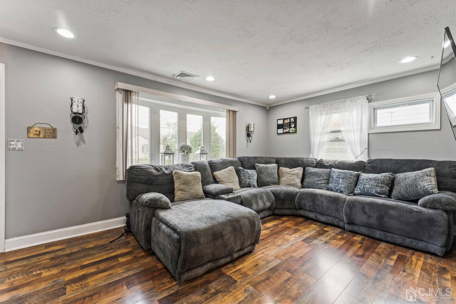 205 Midfield Road Colonia, NJ 07067 - Photo 6 of 26 a living room with furniture and a large window