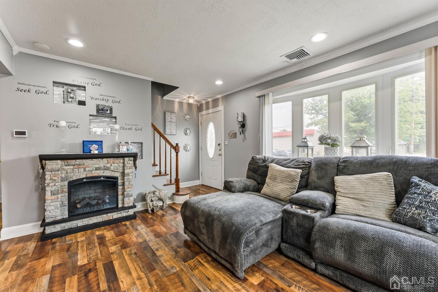 205 Midfield Road Colonia, NJ 07067 - Photo 7 of 26 a living room with furniture and a fireplace