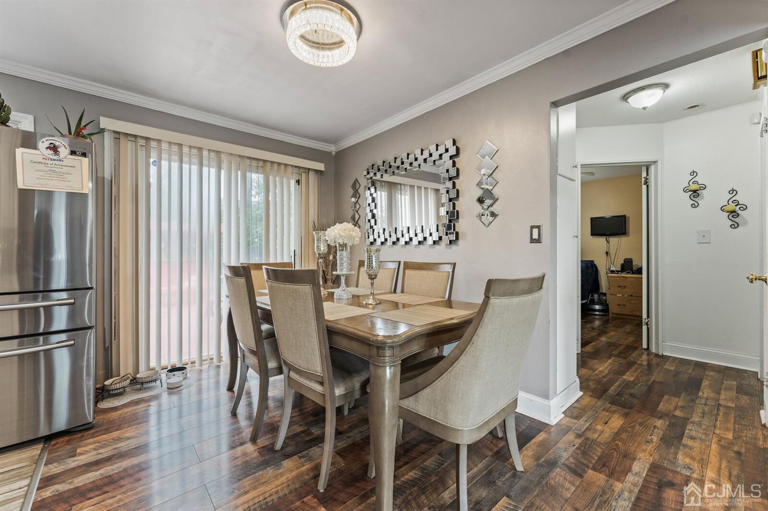 205 Midfield Road Colonia, NJ 07067 - Photo 8 of 26 a view of a dining room with furniture window and wooden floor