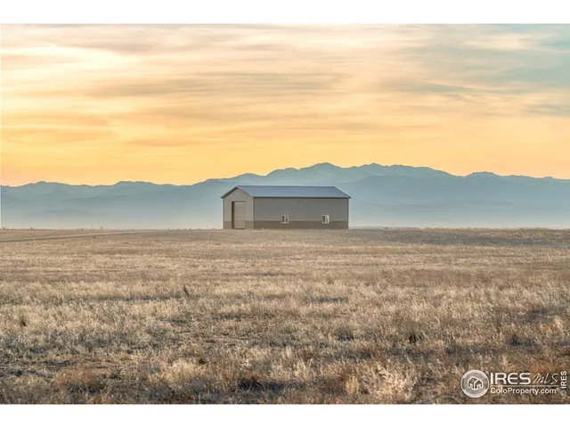 a view of a big yard with an trees