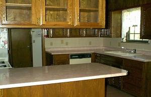 5108 Camp Lane Amarillo, TX 79110 - Photo 3 of 3 a kitchen with stainless steel appliances granite countertop a sink a counter tops and a window
