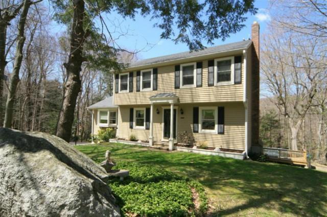 12 Old Country Road Oxford, CT 06478 - Photo 1 of 1 a front view of a house with a yard table and chairs