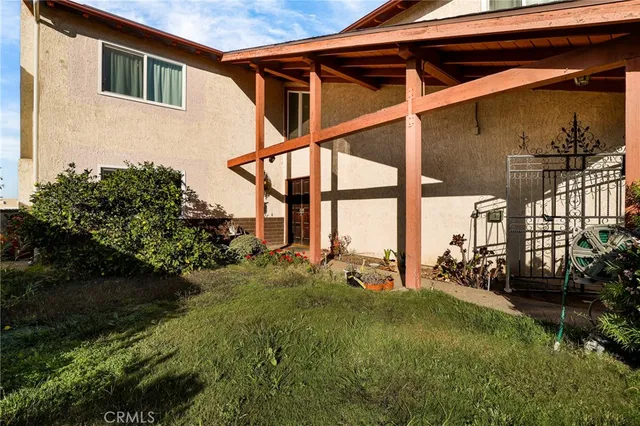 a view of backyard with a garden and plants