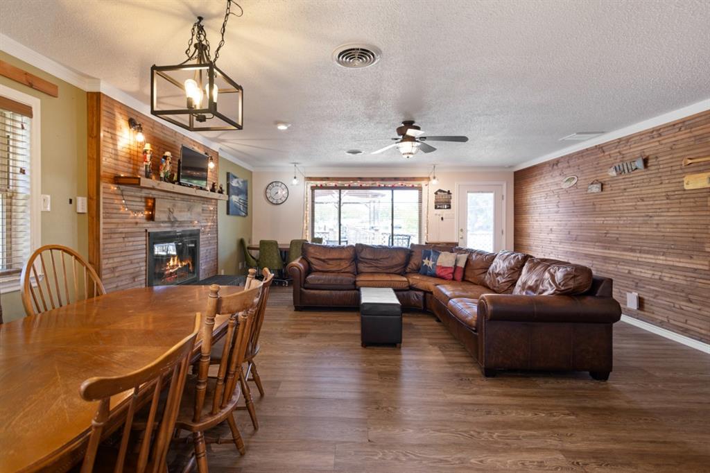 227 Scenic Road Trinidad, TX 75163 - Photo 10 of 40 a living room with fireplace furniture and a flat screen tv