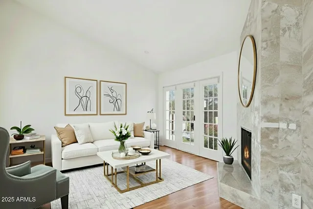 a living room with furniture and a potted plant