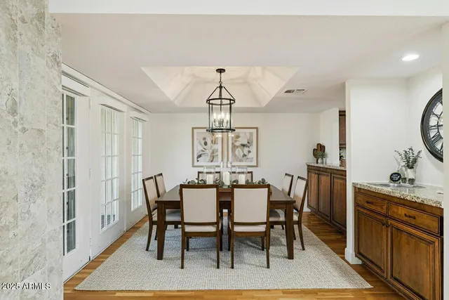a view of a dining room with furniture window and wooden floor