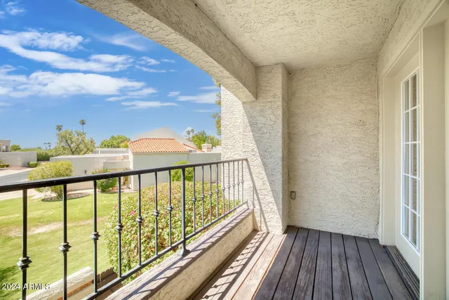 a view of balcony with wooden floor
