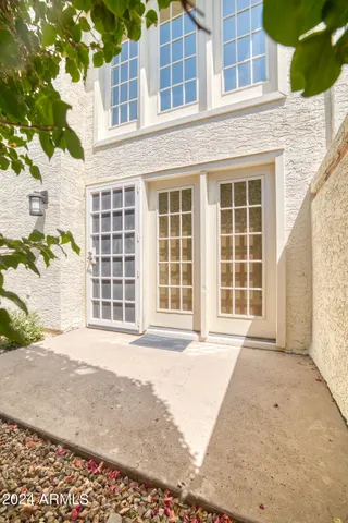 front view of a brick house with a large window