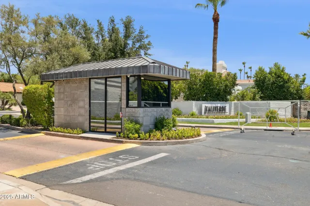 a sign that is in front of flowers