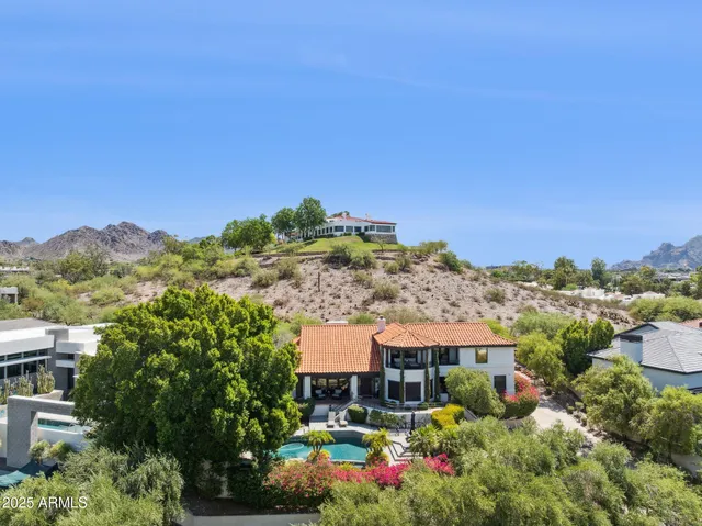 a view of a town with mountains in the background