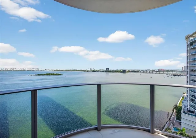 a view of a lake from a balcony