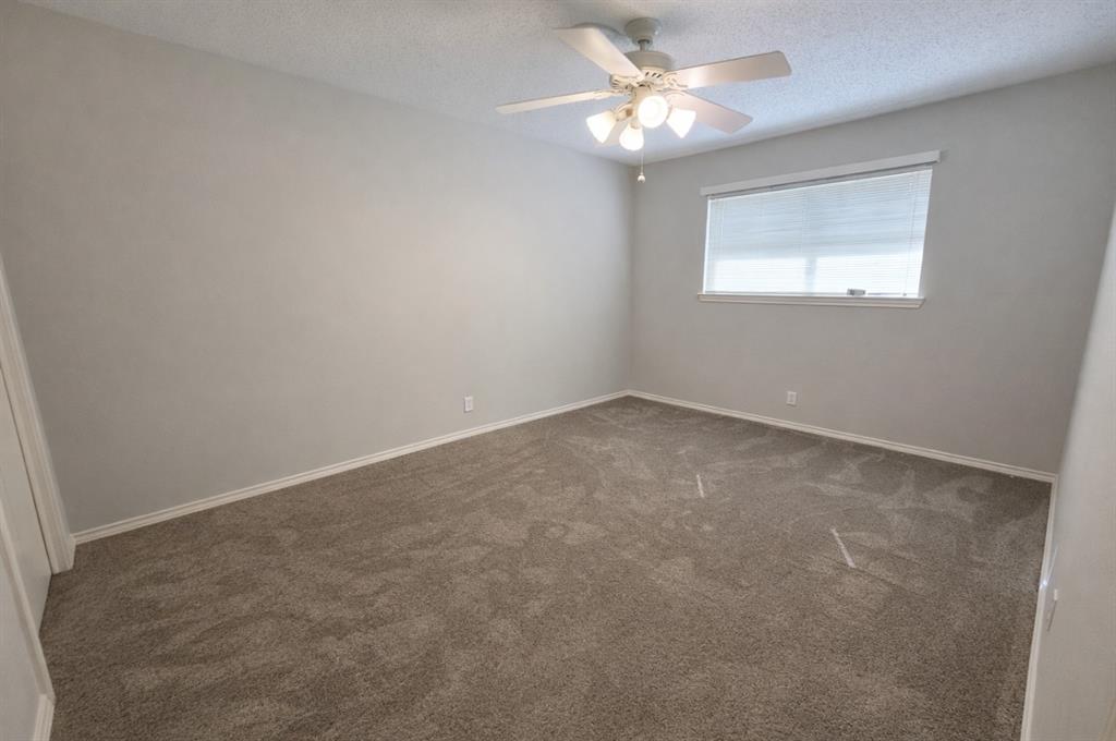 2302 Shiloh Street Denison, TX 75020 - Photo 12 of 16 an empty room with a window