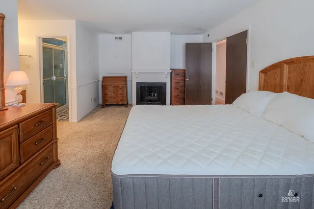 a large white bed in a hotel room