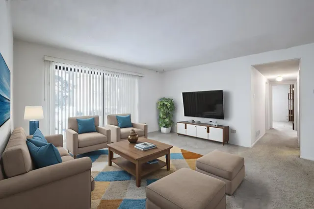 a living room with furniture and a flat screen tv